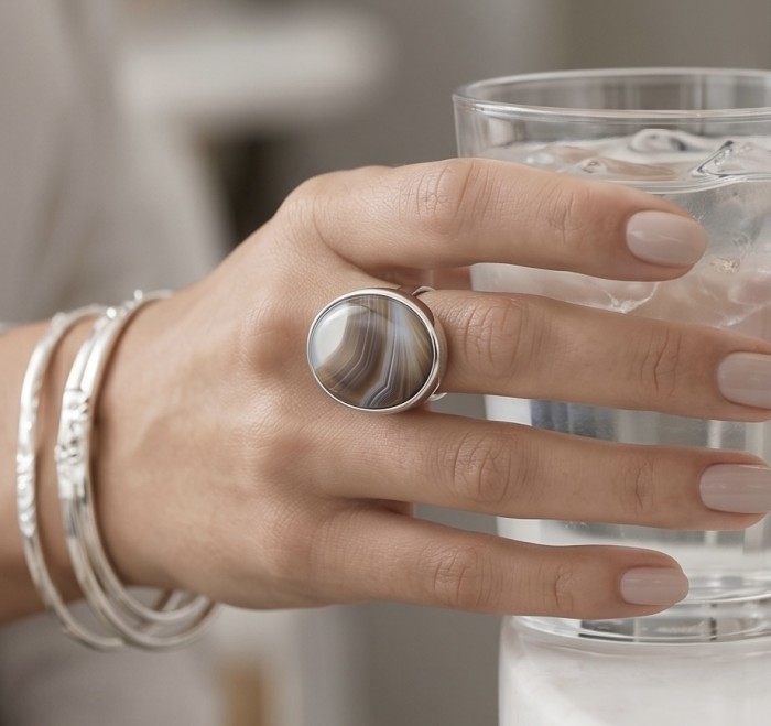 Simplicity Scentic Botswana Agate .925 Sterling Silver handcrafted Ring s. 8 adjustable - Worn on hand: Botswana Agate ring and silver bangles with a glass of water.