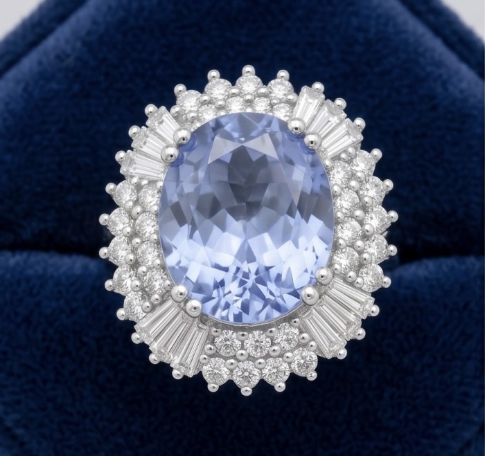 Precious Design oval cut 7.9 CARAT Tanzanite .925 Sterling Silver Statement Ring s. 8 - Close-up of oval cut Tanzanite ring with diamond accents on dark velvet.