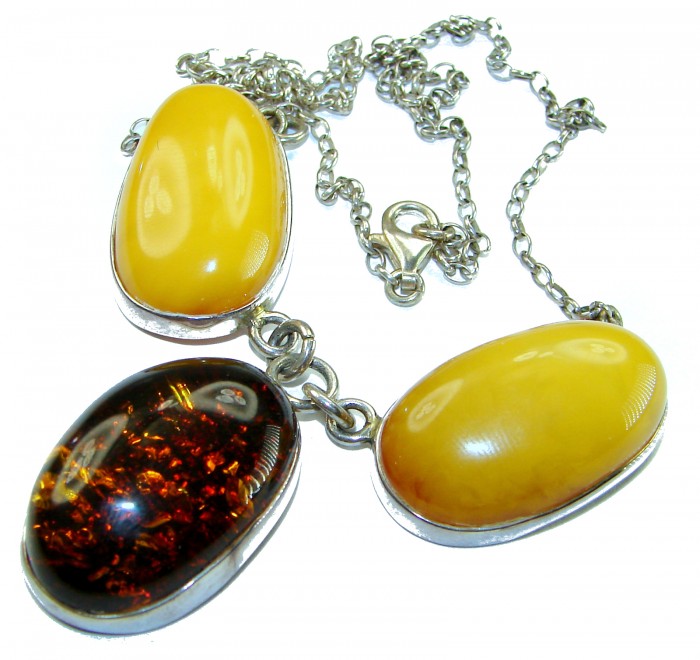 Wonderful 2 Colors Elegant Genuine Baltic Amber .925 Silver handcrafted Necklace - Close-up of Baltic amber pendant necklace with silver chain.