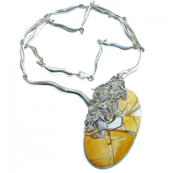 Huge Aura Of Beauty Australian Brecciated Mookaite Jasper .925 Sterling Silver handcrafted necklace - Oval pendant with leaf detail on silver chain, top view.
