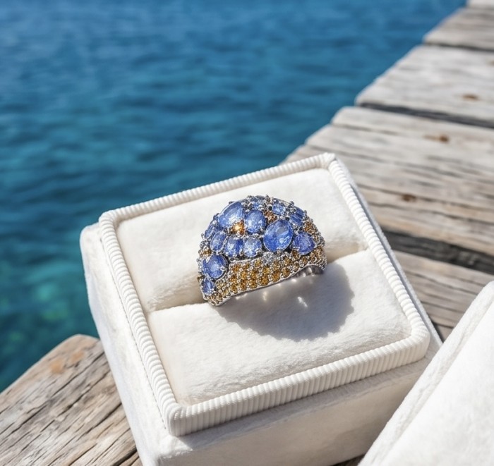 Born to Glam 5.2 carat natural Tanzanite .925 Sterling Silver Perfectly handcrafted Ring s. 8 - Ring with Tanzanite stones in box, ocean background.