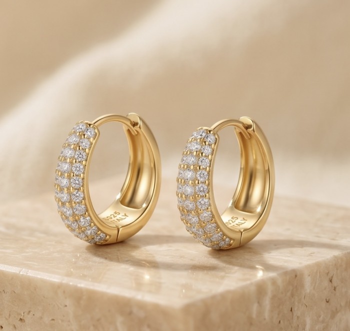 Dubai Style 1.2 carat White Topaz .925 Sterling Silver dipped in 18K Gold handmade Earrings - Gold hoop earrings with white topaz, front angle on marble surface.