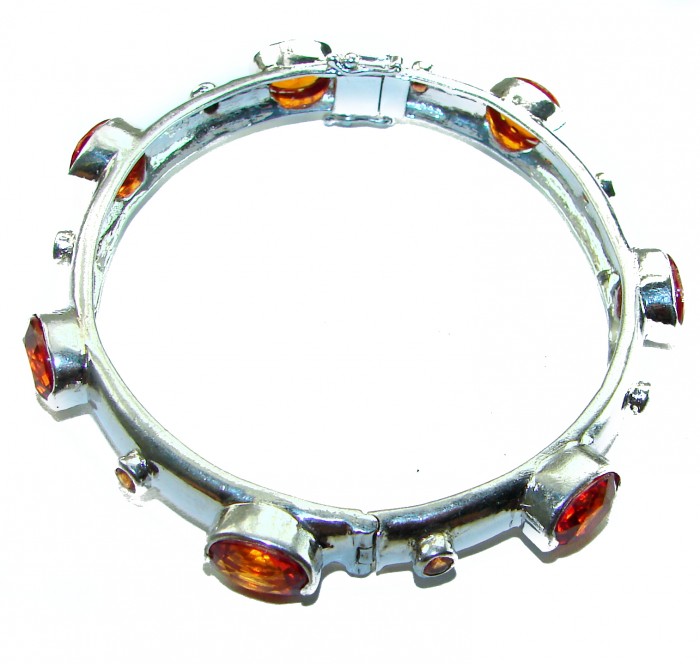 Red Galaxy Spectacular 25.2 carat authentic Ruby .925 Sterling Silver handmade bangle Bracelet - Silver bracelet with red stones, top view.
