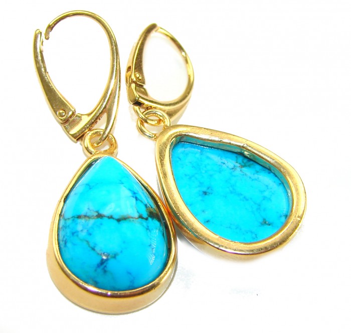 Great authentic Sleeping Beauty Turquoise 18K Gold over .925 Sterling Silver handcrafted Earrings - Close-up of Sleeping Beauty Turquoise earrings with gold detailing.