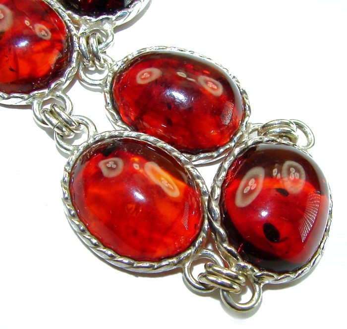Excellent quality Baltic Amber .925 Sterling Silver entirely handcrafted Bracelet - Close-up of oval Baltic Amber stones set in sterling silver.
