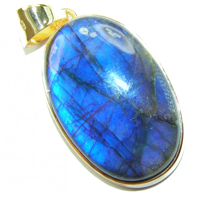 Magical Aurora SILKY Fire Labradorite 14K Gold over .925 Sterling Silver handcrafted Pendant - Oval labradorite pendant with blue sheen and gold bail, close-up view.