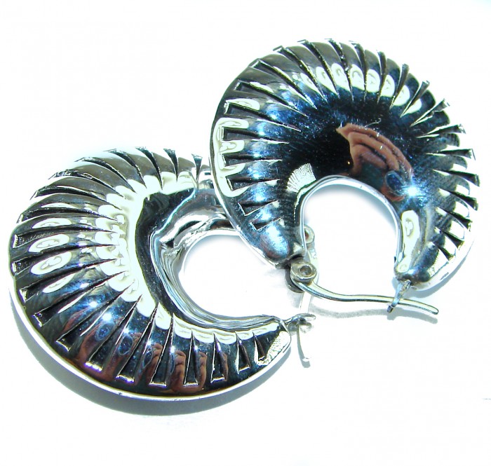 Highly Polished Fancy Modern design .925 Sterling Silver Italy made Earrings - Close-up of polished sterling silver earrings with modern design.