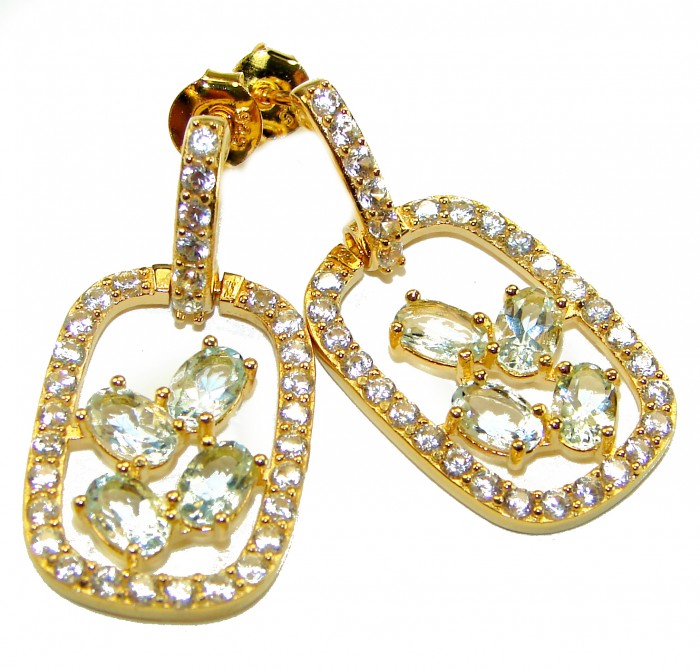 Splendid 10.5 carat Whuet Topaz .925 Sterling Silver dipped in real 18K Gold Handcrafted Earrings - Close-up of gold earrings with white topaz stones and crystal accents.