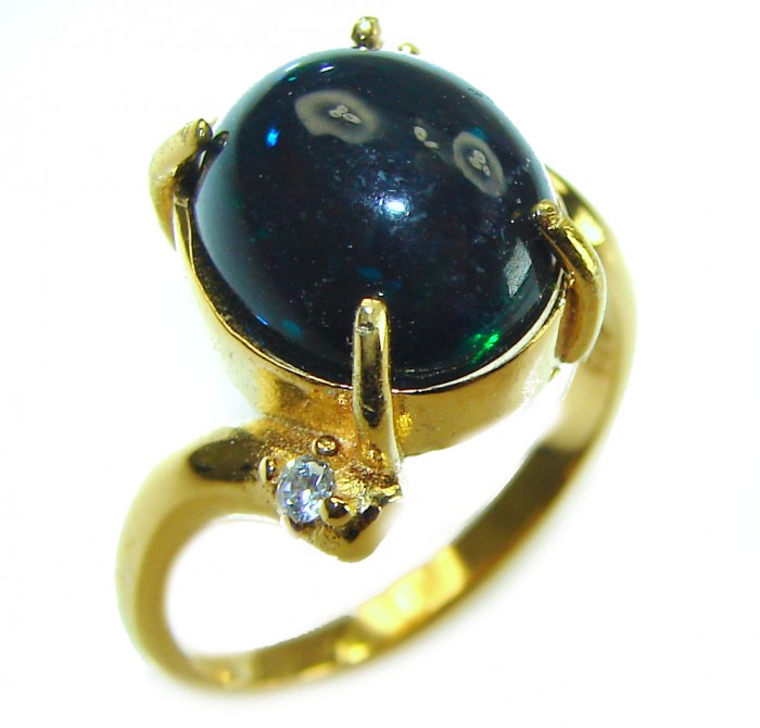A COSMIC POWER Genuine 8.2 carat Black Opal 18K Gold over .925 Sterling Silver handmade Ring size 5 1/2 - Close-up of black opal ring with 18K gold setting and side stone.