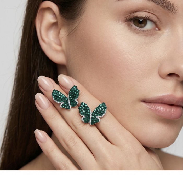 Incredible Butterflies genuine 15.5 CARAT Emerald .925 Sterling Silver handcrafted Earrings - Emerald butterfly ring worn on hand, close-up view