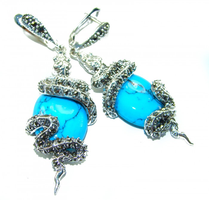Snakes Great authentic inlay Turquoise .925 Sterling Silver handcrafted Earrings - Close-up of turquoise and silver snake design earrings.
