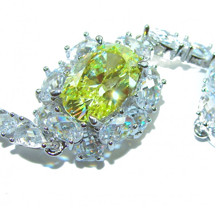 Luxurious 22.5 carat oval cut Authentic Yellow Sapphire .925 Sterling Silver handcrafted Statement Bracelet - Close-up of 22.5 carat yellow sapphire with diamond halo.