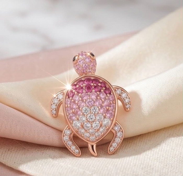 Pink Turtles - authentic 10.8 carat Pink Sapphire 18K Rose Gold over .925 Sterling Silver handcrafted Earrings - Pink turtle brooch with pink sapphires, shown on a fabric background.