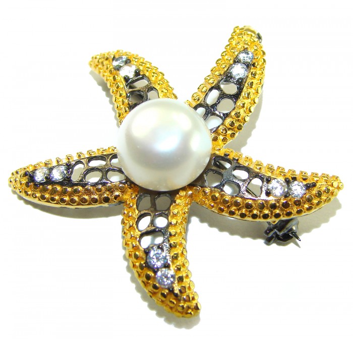 Genuine Mother of Pearl Ruby 14K Gold .925 Sterling Silver handmade Pendant Brooch - Starfish-shaped brooch with pearl, gold, and silver, top view.