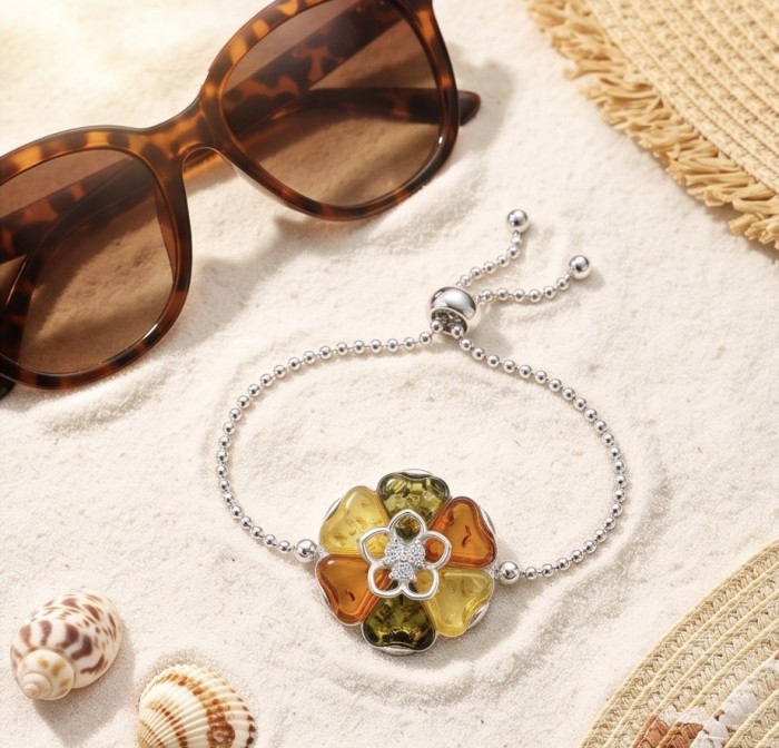 Excellent quality Baltic Amber .925 Sterling Silver entirely handcrafted Bracelet - Bracelet on sand, top view with sunglasses and shells nearby