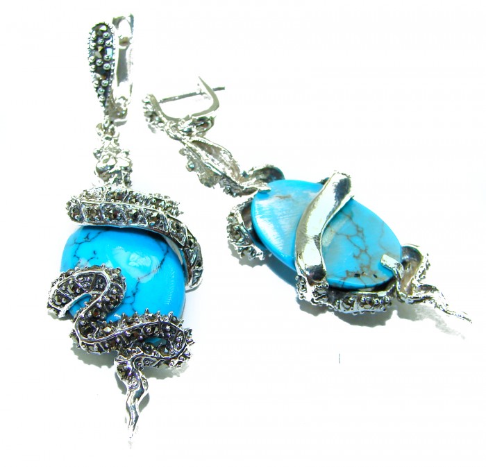 Snakes Great authentic inlay Turquoise .925 Sterling Silver handcrafted Earrings - Side view of sterling silver earrings with turquoise and snake design.