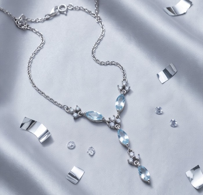 Infinity 9.5 carat Authentic Swiss Blue Topaz Rhodium over .925 Sterling Silver handcrafted Statement necklace - Necklace on satin with Swiss Blue Topaz and rhodium, full view.