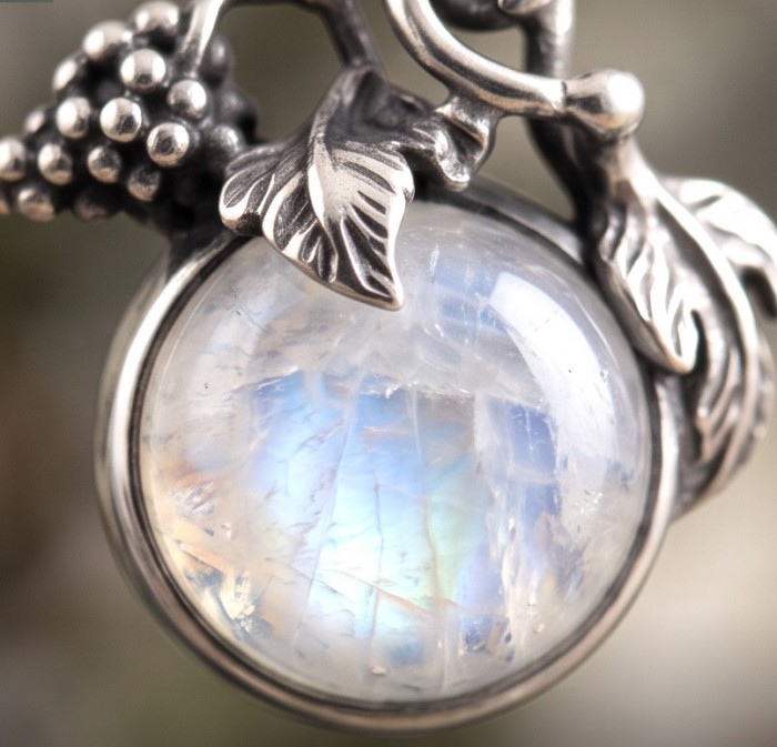 Moonlight Authentic 11.2 carat Fire Moonstone .925 Sterling Silver handmade Satement earrings - Close-up of Fire Moonstone in detailed sterling silver setting
