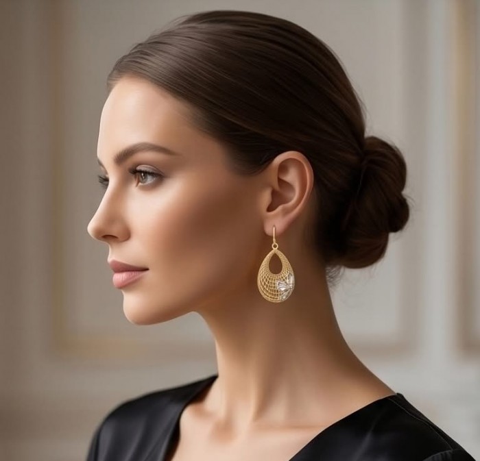 Dubai Style - Silver Flowers - .925 Sterling Silver dipped in 22K Gold handmade Large Earrings - Side view of model wearing large gold teardrop earrings.