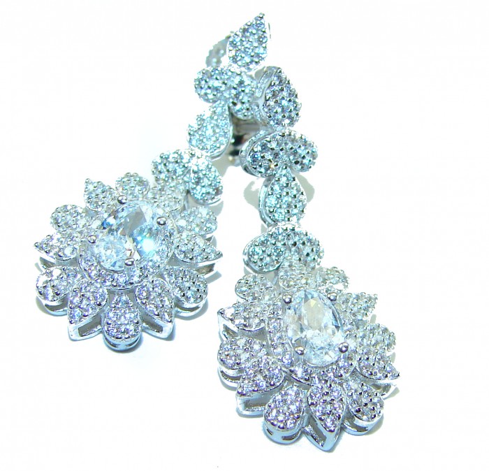 Precious genuine 7.9 carat White Sapphire .925 Sterling Silver handcrafted earrings - Close-up of white sapphire earrings on white background