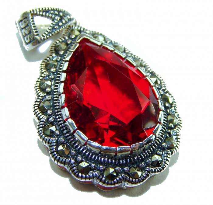 Crimson Fire Authentic 12.4 carat Garnet .925 Sterling Silver brilliantly handcrafted pendant - Close-up of crimson garnet pendant in .925 sterling silver setting.