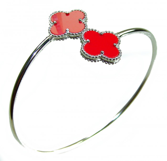 A Red four-leaf clover Coral .925 Sterling Silver handcrafted Bracelet - Red four-leaf clover coral bracelet, side view, sterling silver band.
