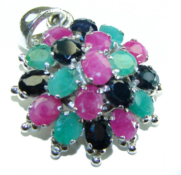 Floral-inspired authentic 10.5 carat Ruby Sapphire .925 Sterling Silver handcrafted Pendant - Floral gemstone pendant close-up showing rubies and sapphires.