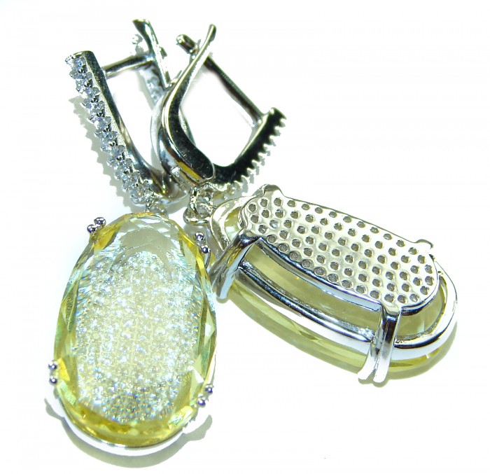 Splendid 14.5 carat Citrine .925 Sterling Silver Handcrafted Earrings - Close-up of citrine gemstone earrings with sterling silver clasp detail.