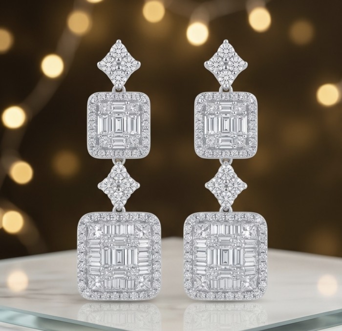 Carolyn - Precious 9.5 carta White Topaz rhodium over .925 Sterling Silver .925 Sterling Silver Statement earrings - Front view of Carolyn white topaz earrings on reflective surface.