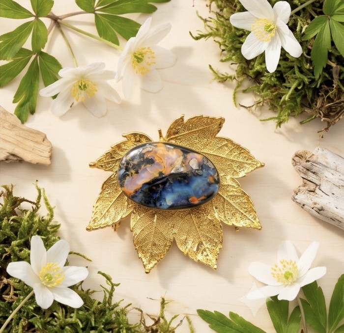 Stylish REAL Leaf dipped in 14K Gold 24.5 CARAT Boulder Opal .925 Sterling Silver Pendant - Gold-dipped leaf with opal, top view, surrounded by flowers and moss.