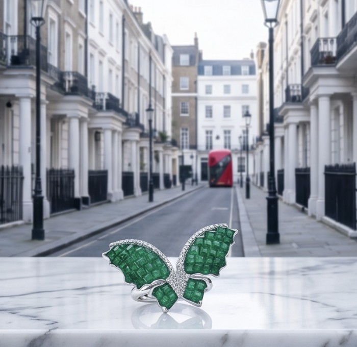 10.2 carat authentic mystery setting Emerald .925 Sterling Silver handcrafted Statement Ring size 7 - Emerald butterfly ring on marble with London street background.