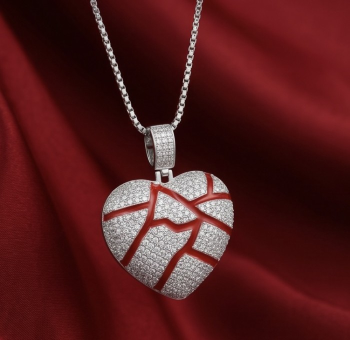 Lava Heart Luxurious 8.4 carat White Topaz .925 Sterling Silver handcrafted pendant - Heart-shaped pendant with white topaz on red fabric background.