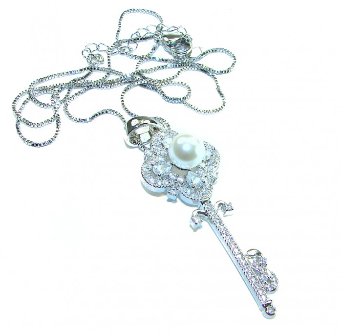 Magic Key- pearl .925 Sterling Silver handcrafted necklace - Magic Key pearl silver necklace, overhead view with chain detail.