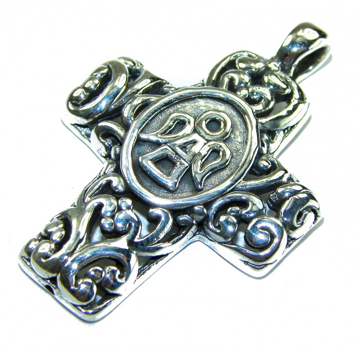 Protective angel - Holy Cross .925 Sterling Silver Pendant - Ornate sterling silver cross pendant with protective angel design, angled view.