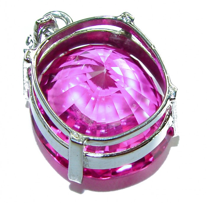 Pink Beauty - Oval cut 14.4 carat Pink Sapphire .925 Sterling Silver handcrafted pendant - Close-up of pink sapphire pendant with silver setting.