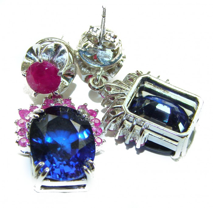 Deep Ocean 24.5 carat London Blue Topaz Ruby .925 Sterling Silver handmade earrings - Close-up of Deep Ocean earrings with blue topaz and ruby stones.