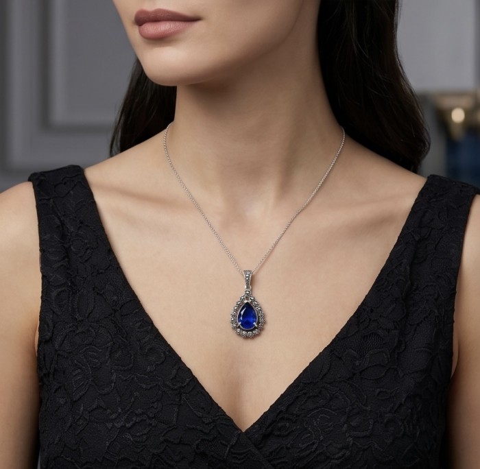Julietta 14.5 carat London Blue Topaz Marcasite .925 Sterling Silver handmade Statement Pendant - Woman wearing Julietta London Blue Topaz pendant necklace close-up.