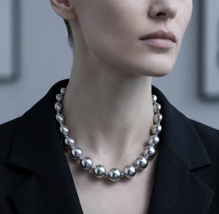 Fancy Italy made Silver Beads Sterling Silver necklace 16'' long, 10 mm wide - Worn on neck, silver bead necklace close-up, black blazer backdrop.