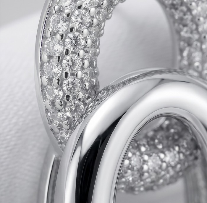 TIFFANY - LUXURIUS - Natural pave White Topaz rhodium over .925 Sterling Silver handmade earrings - Close-up of pave white topaz on rhodium jewelry piece.