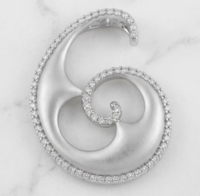 Waves 0.5 carat authentic White Topaz .925 Sterling Silver Handcrafted Pendant - Spiral pendant with topaz accents, top view on marble background.