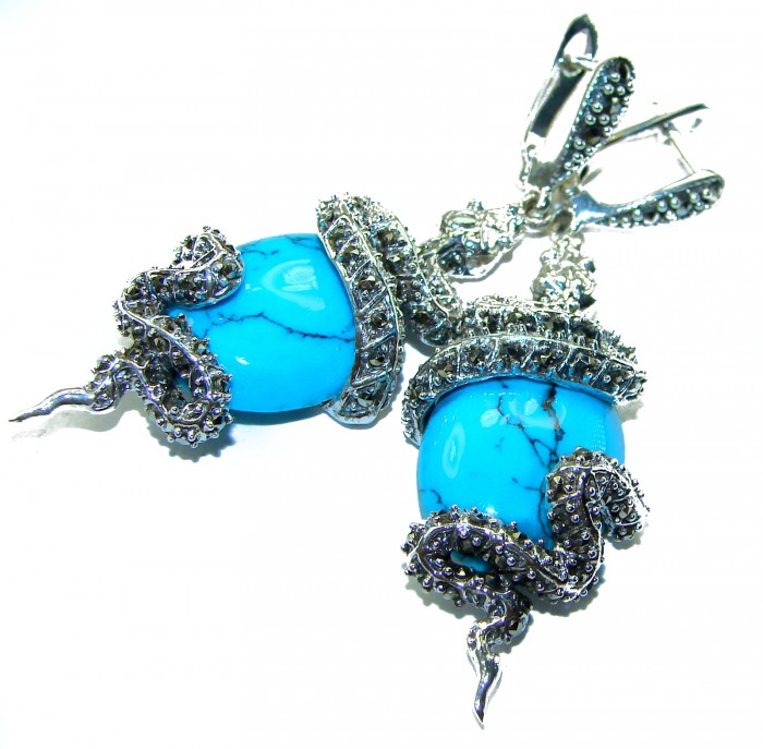 Snakes Great authentic inlay Turquoise .925 Sterling Silver handcrafted Earrings - Close-up of turquoise and silver snake earrings.
