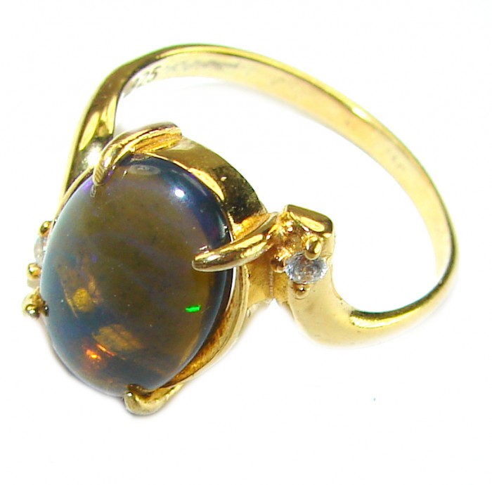 A COSMIC POWER Genuine 8.2 carat Black Opal 18K Gold over .925 Sterling Silver handmade Ring size 8 - Side view of 8.2 carat black opal ring in 18K gold setting.