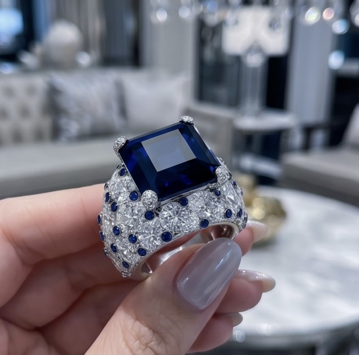 Blue Royalty 15.5 ctw natural Sapphire .925 Sterling Silver handcrafted large Statement Ring size 8 - Close-up of Blue Royalty ring with sapphire and diamonds in hand