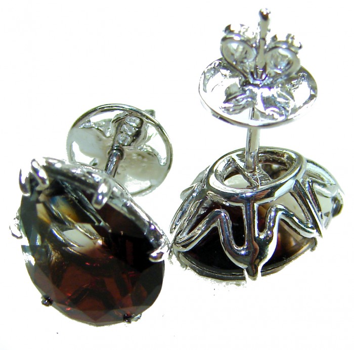 From dawn to dusk authentic 11.2 carat Brazilian Smoky Topaz .925 Sterling Silver handcrafted earrings - Close-up of Brazilian smoky topaz earrings with intricate silver setting.