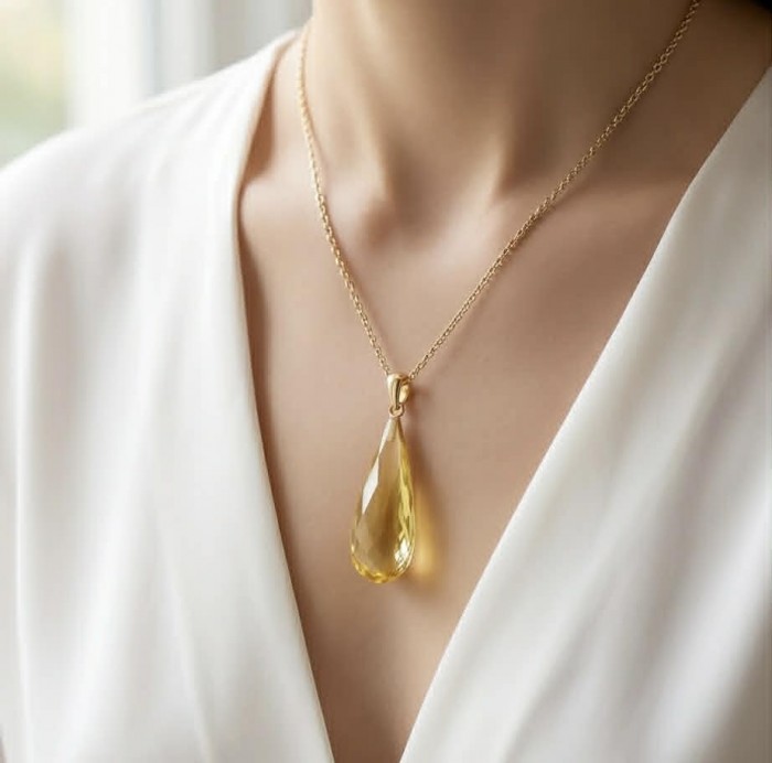 Prehistoric Authentic faceted Golden Baltic Amber REAL 14k Gold beautifully handcrafted Pendant - Golden Baltic Amber necklace worn on neck, front view.