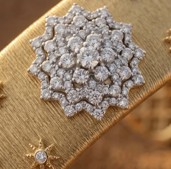 Spectacular authentic 10.8 carat White Topaz 14K Gold over .925 Sterling Silver handmade cuff Bracelet - Close-up of intricate diamond cluster on gold jewelry.