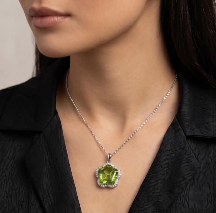 Green Clover 6.8 carat authentic Brazilian Peridot .925 Sterling Silver Handcrafted Statement pendant - Green clover pendant necklace worn close-up view.