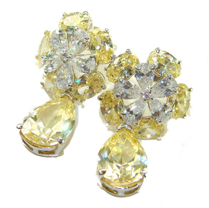Luxurious 10.5 carat Golden - yellow Montana Sapphire .925 Sterling Silver handcrafted earrings - Elegant earrings with golden-yellow stones, front view.