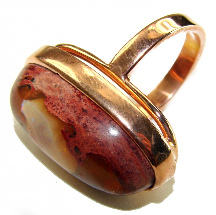 Queen of Fire best quality 25.4 carat Mexican Opal 18K Rose Gold over .925 Sterling Silver handmade ring 8 adjustable - Side view of 25.4-carat Mexican Opal ring in 18K rose gold.