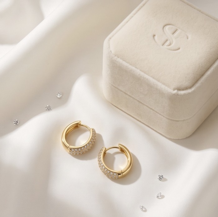 Dubai Style 1.2 carat White Topaz .925 Sterling Silver dipped in 18K Gold handmade Earrings - Gold hoop earrings with topaz near velvet box on satin fabric.